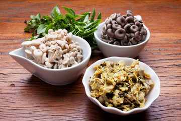 Nutrition concept - Healthy meals in glass jars over wooden background. Homemade mushroom and salad. Healthy food, Diet, Detox, Clean Eating or Vegetarian concept