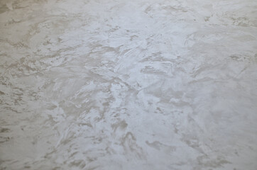 Silk decorative plaster. Texture Handmade. Selective focus.