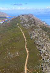 Cape Town, Western Cape / South Africa - 03/27/2017: Aerial photo of a mountain path with Steenbras Dam in the background