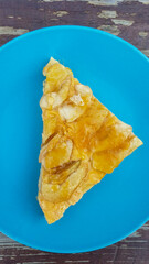 Apple pie on blue plate