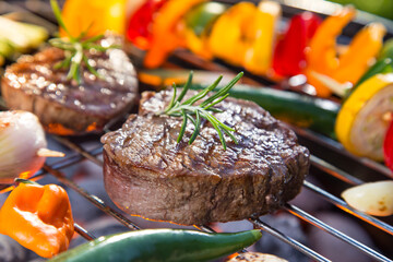Barbecue garden grill with beef steaks, close-up.