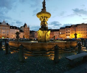 Old square in Ceske Budejovice with a fountain and tenements around