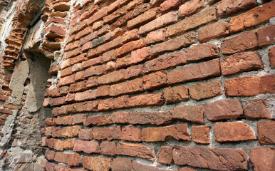 Weathered stained old brick wall beautiful background.