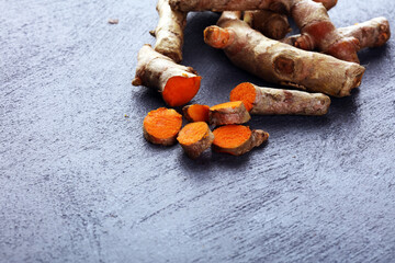 fresh turmeric on grey background