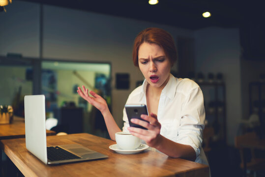 Portrait of beautiful business woman feeling upset about rate popularity falling because of bad advertising campaign worried about company income while working via modern digital devices and wifi