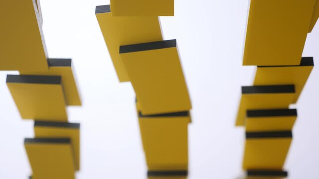 Yellow dominoes placed in cascade row, knocked down. Domino effect, chain reaction. Mechanical effect. Cumulative effect produced when one event sets off a chain of similar events. Loss of power