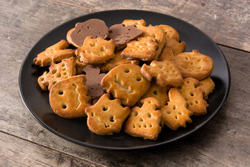 Funny Halloween cookies on wooden table