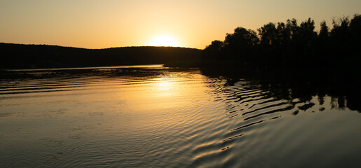 Beautiful sunset reflected in the lake.
