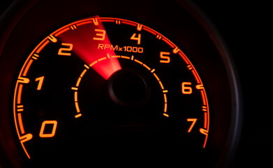 Driver's cockpit ; speedometer on dashboard - colorful light in black, copy space for your abstract...