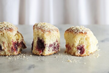 Soft Sweet Vanilla Buns filled with Homemade Berry Jam. Copy space