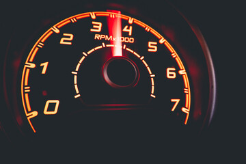 Driver's cockpit ; speedometer on dashboard - colorful light in black, copy space for your abstract...