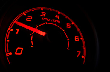Driver's cockpit ; speedometer on dashboard - colorful light in black, copy space for your abstract design	