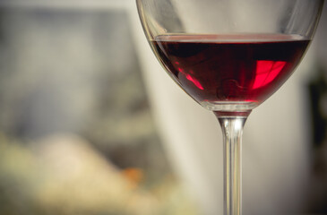 A glass of red wine in an isolated background. close up