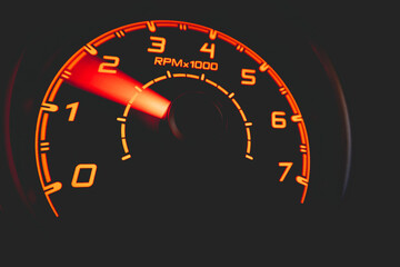 Driver's cockpit ; speedometer on dashboard - colorful light in black, copy space for your abstract...