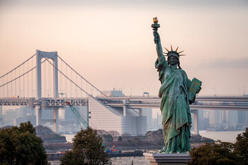 Standing only 40 feet tall, the Tokyo Statue of Liberty seems much larger as it stands near Tokyo Bay and and famous Rainbow Bridge.