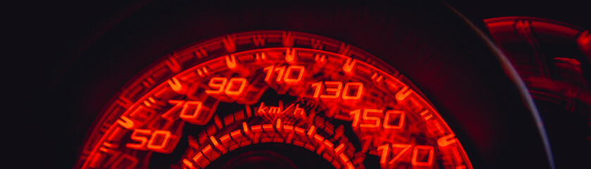 Driver's cockpit ; speedometer on dashboard - colorful light in black, copy space for your abstract...