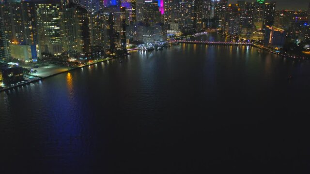 Aerial tilt up reveal Brickell Miami city lights 4k