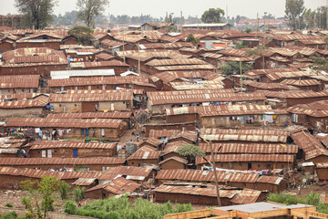 Corrgutead metal roofs with adobe walls makeup crowded and dirty slums near Nairobi, Kenya.