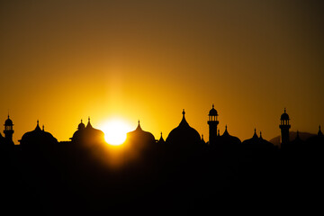 Fototapeta premium silhouette of a mosque at sunset