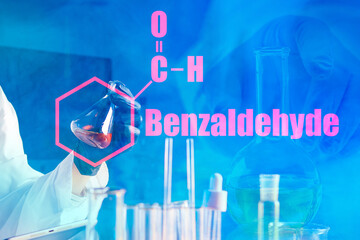 Benzaldehyde. The inscription benzaldehyde and molecular formula on a blue chemical background....