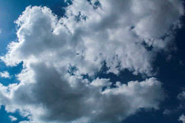 A large white cloud against the sky of azure color.