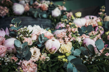 Beautiful flower arrangement made out of peonies, lisianthus and eucalyptus