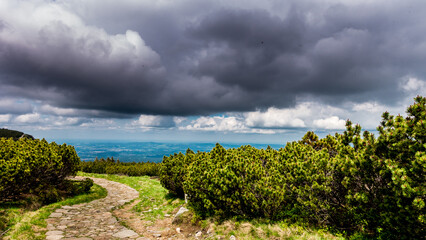 Rainy clouds over the path leading over Big Pond