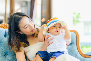Happy Asian  7 months baby boy with his mother traveling in summer,Happy family concept