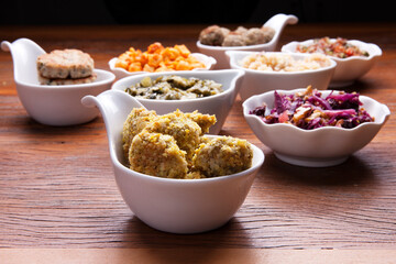 Nutrition concept - Healthy meals in white bowls over wooden background. Healthy food, Diet, Detox, Clean Eating or Vegetarian concept. 
