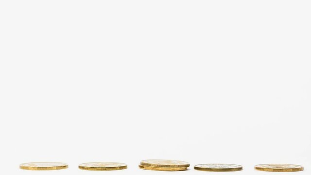 Four piles of golden coins descent, disappear, decrease at white isolated background, financial market crush down, spending money concept