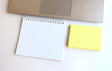Modern workspace with notebook, tablet and laptop copy space on white color background. Top view. Flat lay style.