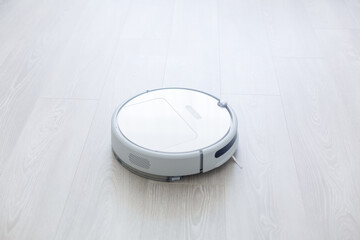 robotic vacuum cleaner on laminate wood floor smart cleaning technology