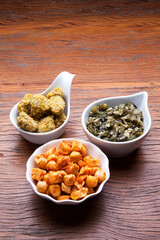 Nutrition concept - Healthy meals in white bowls over wooden background. Healthy food, Diet, Detox, Clean Eating or Vegetarian concept. Top view sets.
