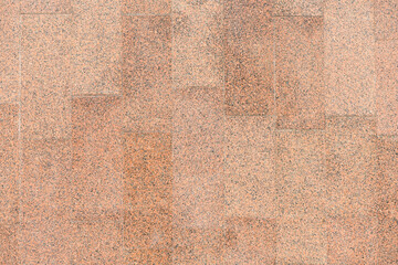 Red granite slab closeup, for background or texture.