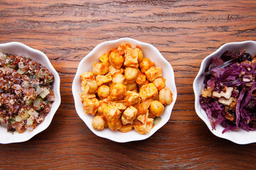 Nutrition concept - Healthy meals in white bowls over wooden background. Healthy food, Diet, Detox, Clean Eating or Vegetarian concept. Top view sets.