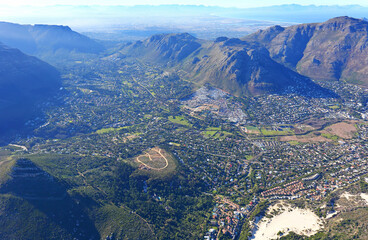 Cape Town, Western Cape / South Africa - 06/07/2019: Aerial photo of Hout Bay with Cape Flats in the background