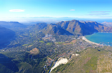 Cape Town, Western Cape / South Africa - 06/07/2019: Aerial photo of Hout Bay and Hout Bay Harbour with Chapman's Peak in the background