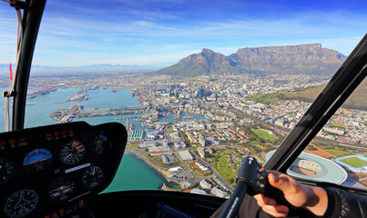 Cape Town, Western Cape / South Africa - 06/24/2019: Pilot's view of Cape Town CBD and V&A Waterfront with Table Mountain in the background