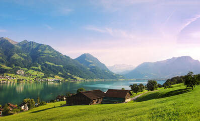Picturesque landscape panorama in central Switzerland. Mountains and alpine villages on the shores of Lake Sarnersee.