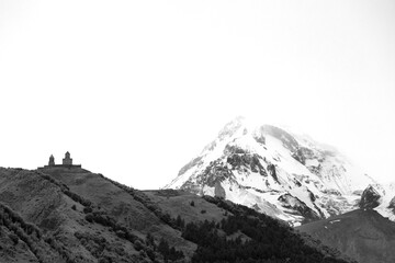 Fototapeta na wymiar Gergeti Trinity Church and Kazbegi mountain, Georgia