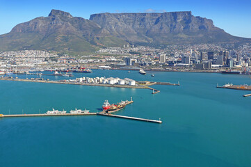 Cape Town, Western Cape / South Africa - 09/05/2019: Aerial photo of a vessel with Cape Town Harbour and Table Mountain in the background