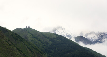 Gergeti Trinity Church and Kazbegi mountains, a panaormic view