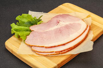 Sliced pork belly over board