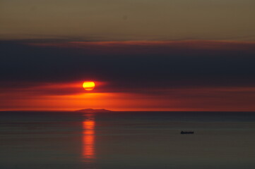 A Vessel Passes In Front of St. Nicolas Island During an Epic Sunset