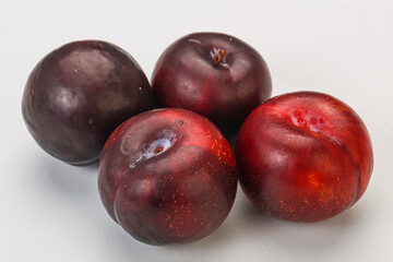 Ripe sweet plum fruit heap