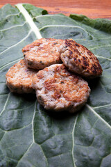 Nutrition concept - Healthy hamburgers with cabbage leaf over wooden background. Healthy food, Diet, Detox, Clean Eating or Vegetarian concept