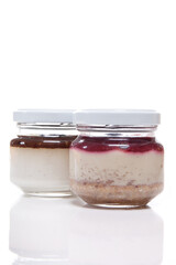 Nutrition concept - Healthy meals in glass jars over white background. Healthy take-away lunch jar. 