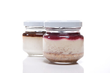 Nutrition concept - Healthy meals in glass jars over white background. Healthy take-away lunch jar. 