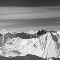 Black and white view on snowy high mountains in winter