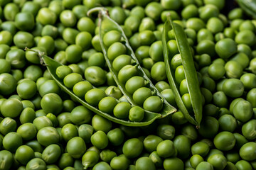 Fototapeta na wymiar Fresh young green peeled peas background